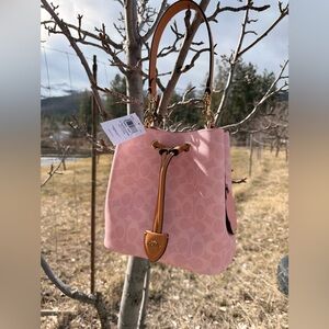 Coach Powder Pink Rowan Bucket Bag In Signature Canvas With Charms